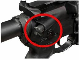 AR15 forward assist with red circle around it
